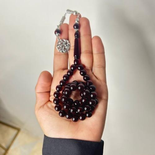 سبحة بكلايت بلون عنابي شفاف