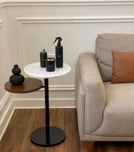 Natural marble surface serving table with antiqued...