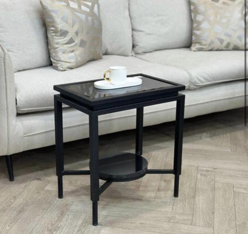 Black glass surface serving table
