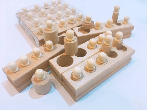 الاسطوانات الخشبية ذات المقبض