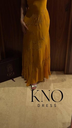 فستان سهرة ذهبي جورجيت مطرز فاخر بتصميم انسيابي جذ...