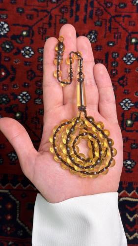 مسبحة بكلايت عسلي مكحّل