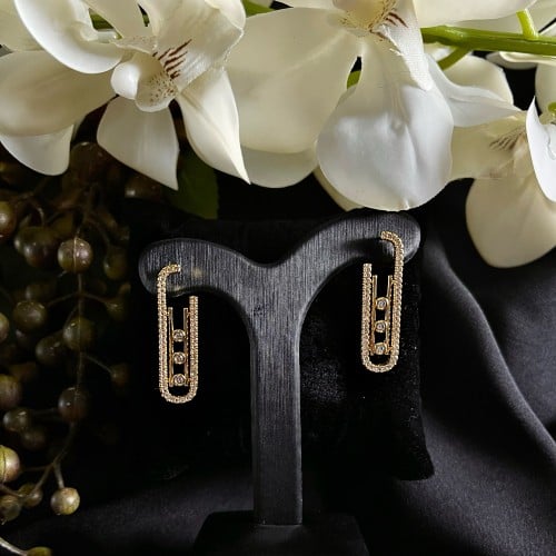 حلق ذهبي تصميم ( Messika )