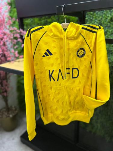 بلوفر شتوي نادي النصر 2026 أصفر دافئ وأنيق