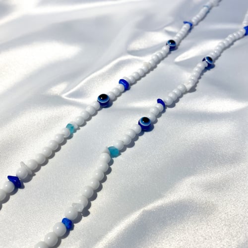 سلسلة للنظارة أبيض مع العين الزرقاء | Eyeglasses s...