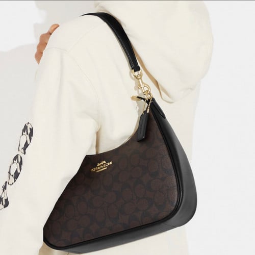 شنطة كوتش جلد بني مطبوع حجم عملي