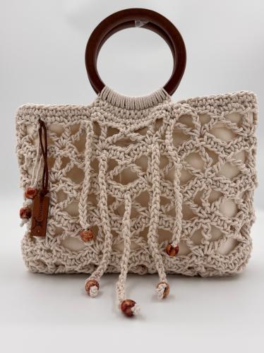 A strap for a crochet bag with a wooden hand