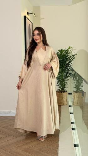 جلابية لينن ممزوجة بالترتر اللماع في الصدر والاكما...