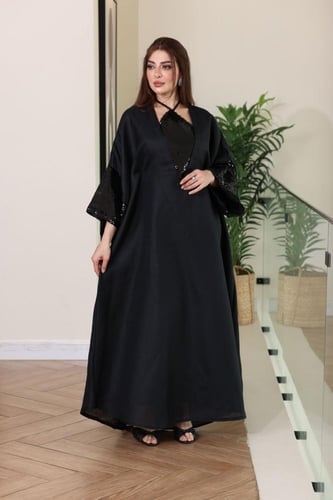 جلابية لينن ممزوجة بالترتر اللماع في الصدر والاكما...