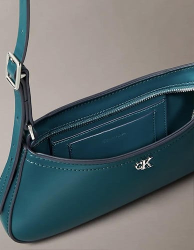 حقيبة كتف معدنية بشعار مونوغرام