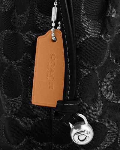 حقيبة فاي الصغيرة برباط / براند كوتش