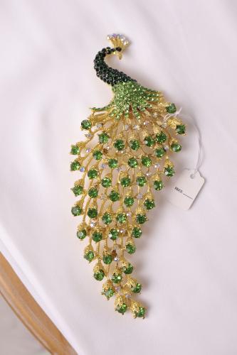 Green crystal peacock brooch