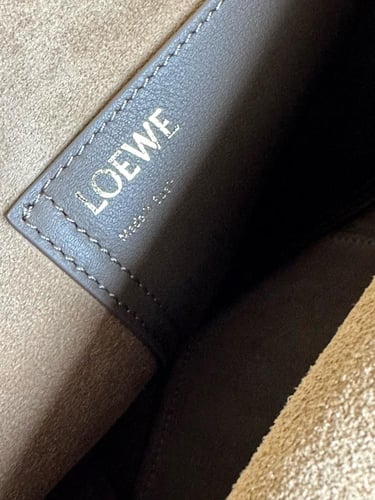 Mini Pebble bucket in soft grained calfskin Master...