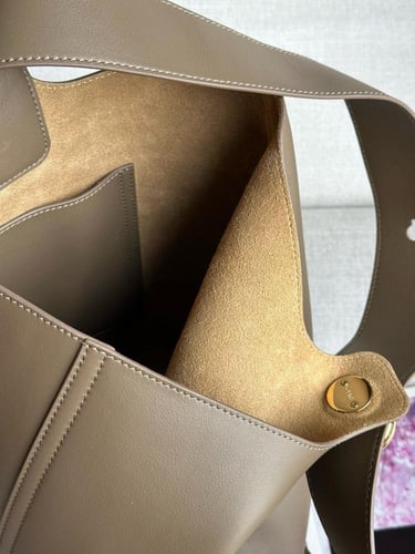 Mini Pebble bucket in soft grained calfskin Master...