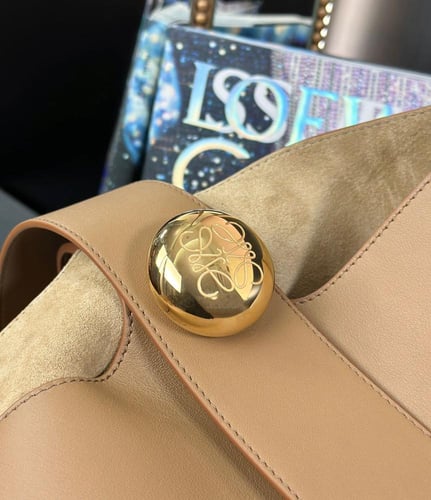 Mini Pebble bucket in soft grained calfskin Master...