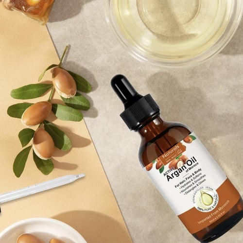 ناتشورال زيت لنمو الشعر والحواجب والرموش بزيت الار...