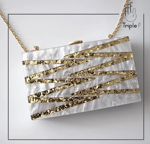 Pearl and gold clutch