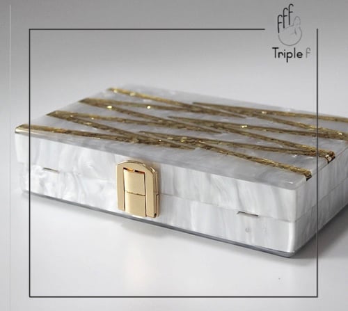 Pearl and gold clutch