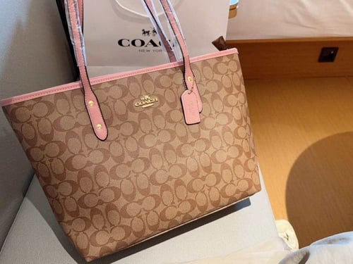 حقيبة كوتش مسكات وردي فاتح