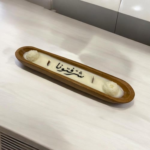 شمعة بقالب خشبي