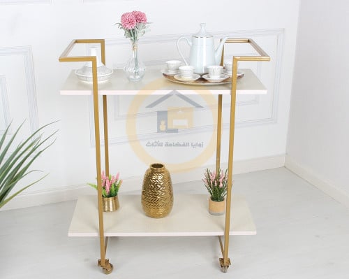 عربية تقديم لون ذهبي 2 دور سطح خشبي اللون بيج