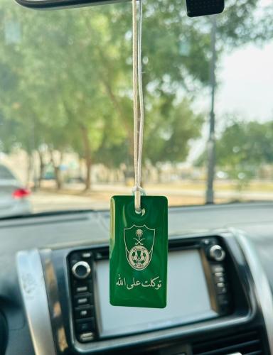 تعليقة سيارة بتصميم انيق بشعار الأهلي مع عبارة إسل...