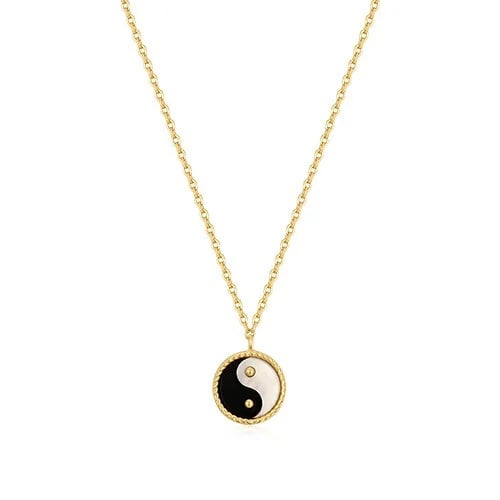 Grove necklace with a circular pendant bearing the...