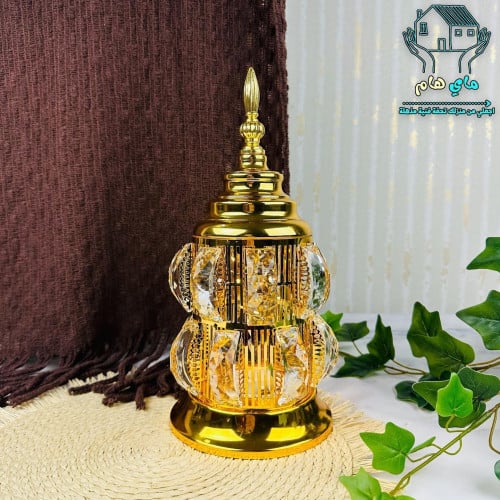 فانوس مضىء بحديد ذهبي تتوسطه كريستالات شفافه، يعمل...