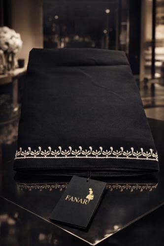 A embroidered headscarf from the edge