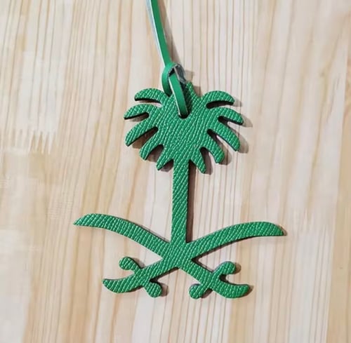 تعليقه سيفين ونخلة