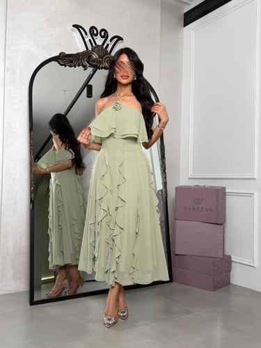 فستان ناعم بقصه توب وكشكش من تحت