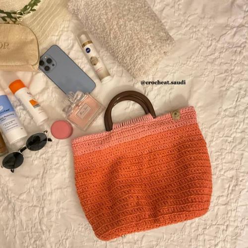 شنطة يد برتقالي