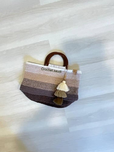 شنطة يد درجات البني