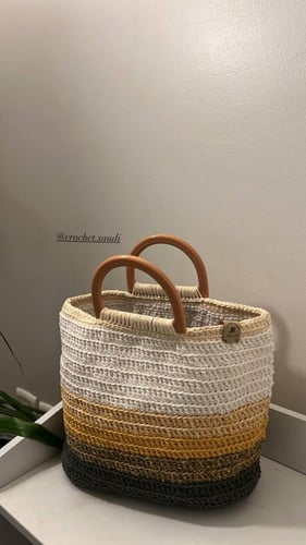 شنطة يد درجات البني