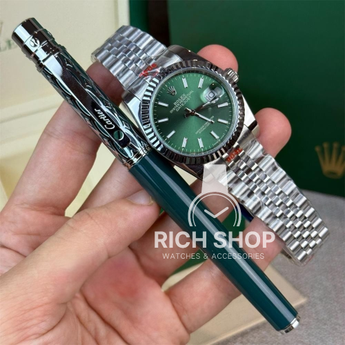 طقم ساعة رولكس دايجست وسط مع قلم كارتير باللون الأ...