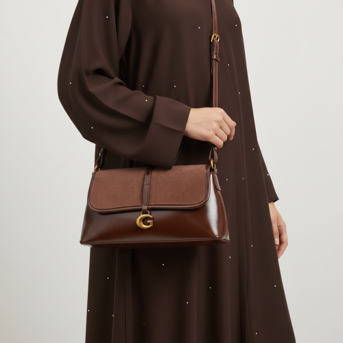 شنطة يد نسائية جلدية بتدخيلة مخمل - بني