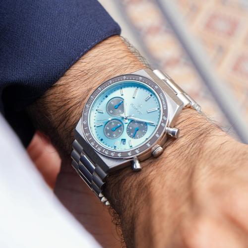 ساعة رجالية بسير ستيل وميناء أزرق فاتح ورمادي - تص...