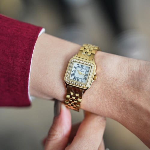 ساعة نسائية بسير ستيل ذهبي بإطار مربع مرصع - تصميم...