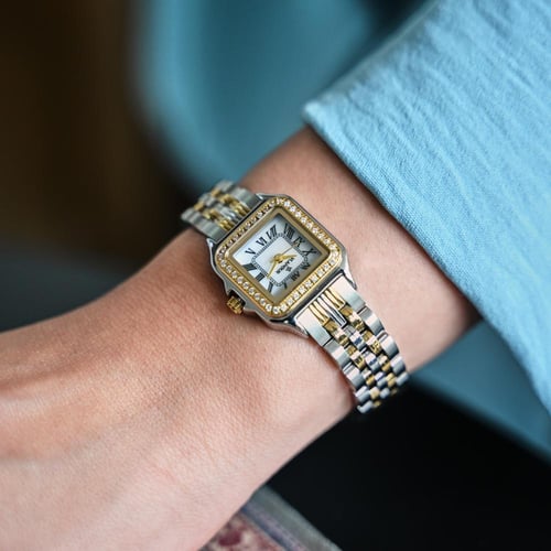 ساعة نسائية بسير ستيل بلونين فضي وذهبي - حضور مميز