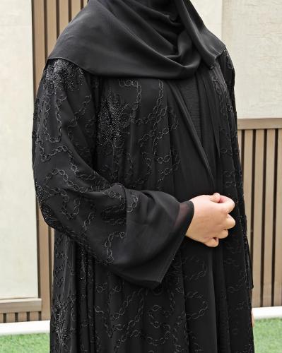 A black abaya fully embroidered