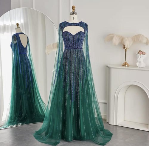 فستان مزين بالترتر مع كيب طويل منفصل