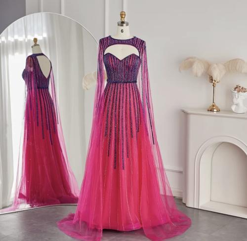 فستان مزين بالترتر مع كيب طويل منفصل