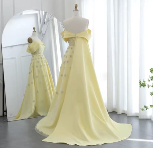 فستان سهره مكشوف الكتفين باللون الأصفر