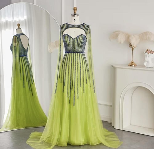 فستان مزين بالترتر مع كيب طويل منفصل