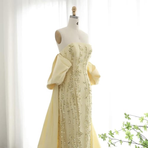 فستان راقي تطريز كامل بقطعة خلفية طويلة