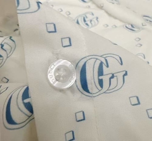 قميص قوتشي اولاد ابيض