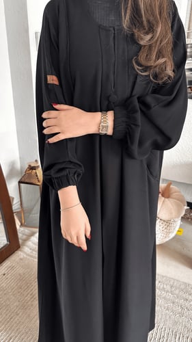 عباية كم قبضة بجيوب أمامية