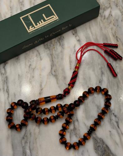 A prayer bead with a turquoise agate pendant