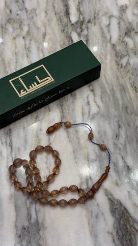 A prayer bead with a clip for ownership
