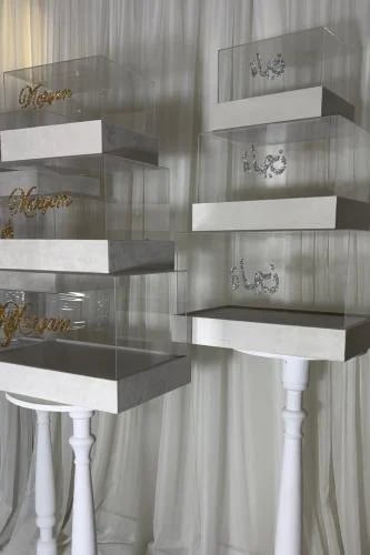 Acrylic Dabsh boxes and a velvet base with gold and silver crystal writing